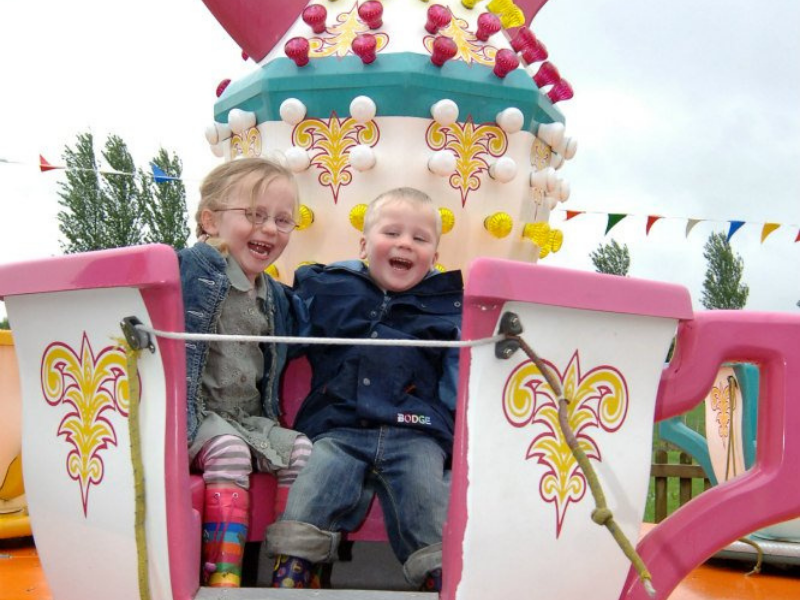 Fair ground teach ride with children having fun