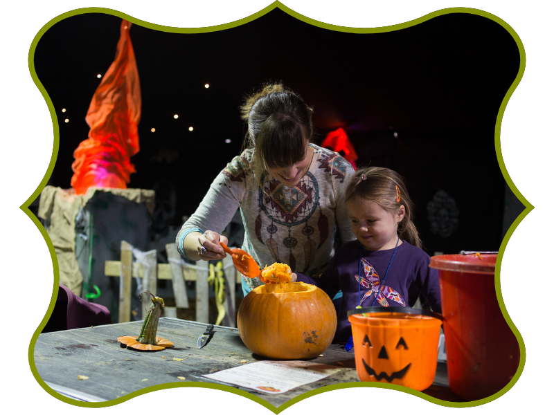 green cutout of a family carving pumpkins